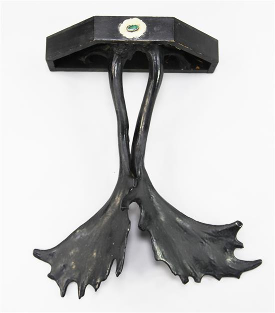 In the manner of Anthony Redmile. An ebonised wall bracket, 22.5in.